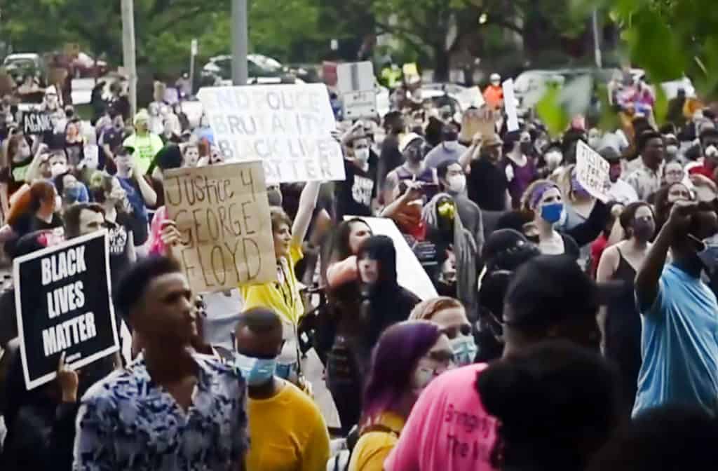 Protestors marched May 26 from the scene of George Floyd's encounter with police to a Minneapolis police precinct station.