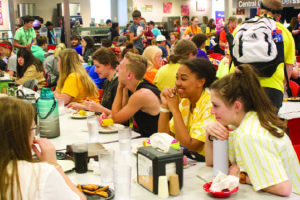Students gather to enjoy a meal in the cafeteria.