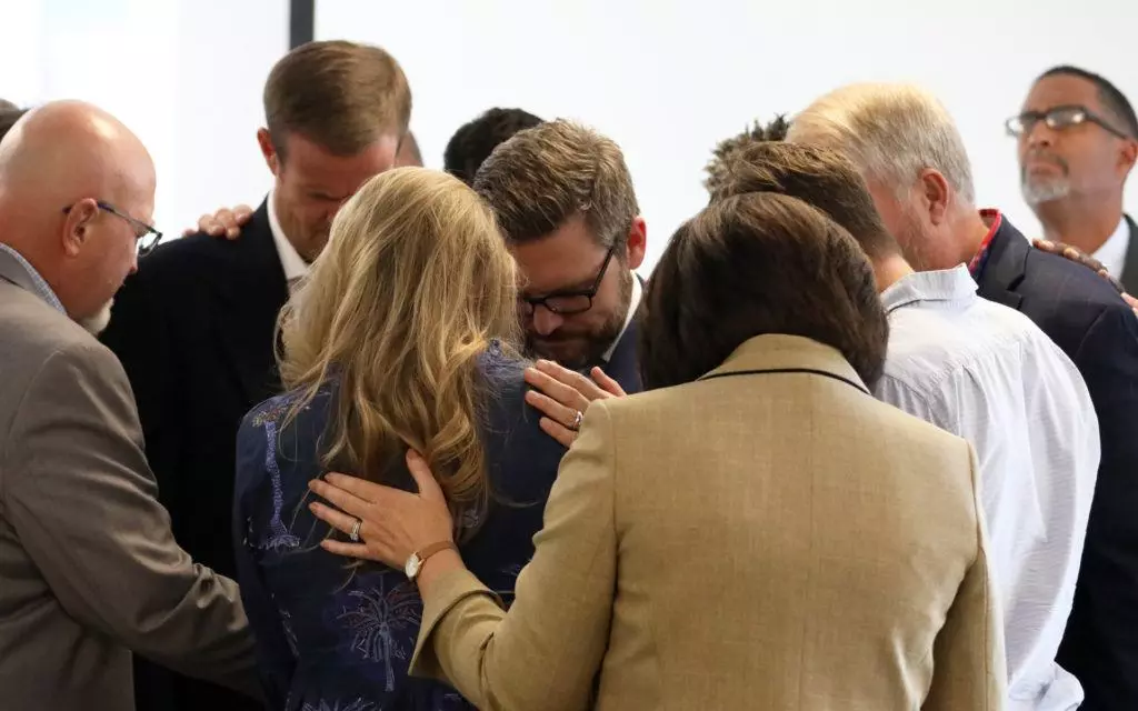 Trustees of the Ethics & Religious Liberty Commission pray for Brent and Meredith Leatherwood following the announcement of Brent's election as the next president of the ERLC. (Baptist Press/Brandon Porter)