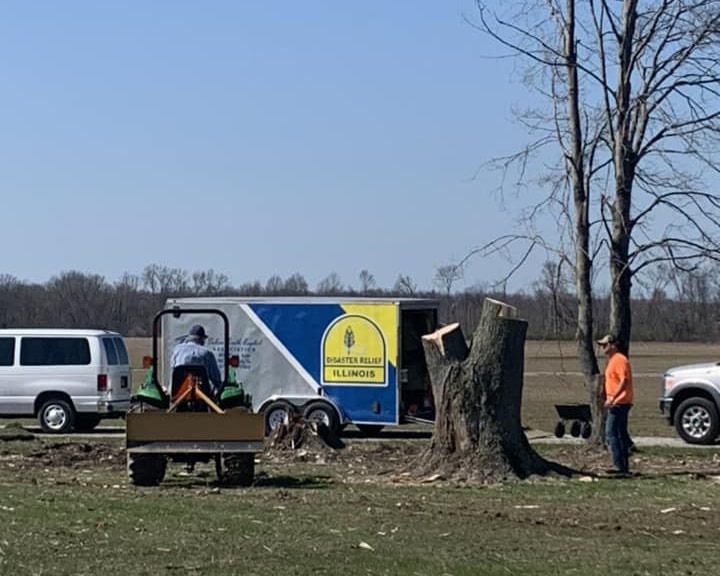 IBDR volunteers remove trees downed by a tornado that struck Crawford County March 31, 2023.