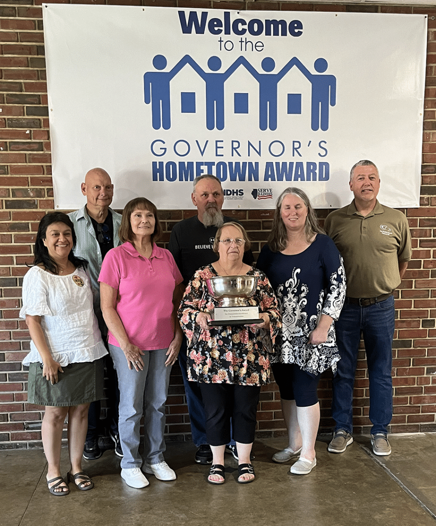 The delegation from Pleasant Hill First Baptist Church pose with the Governor's Cup Award they received for their summer feeding ministry.