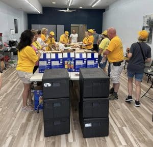 Illinois Baptist Disaster Relief volunteers based at Armitage Baptist Church prepare and package sack lunches for participants.