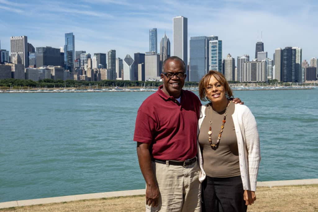 Keith and Deborah Jefferson pose for a quick portrait in front of the Chicago skyline.