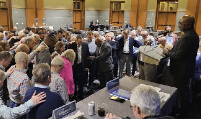 Trustees prayed over Ann and Jeff Iorg after the vote.